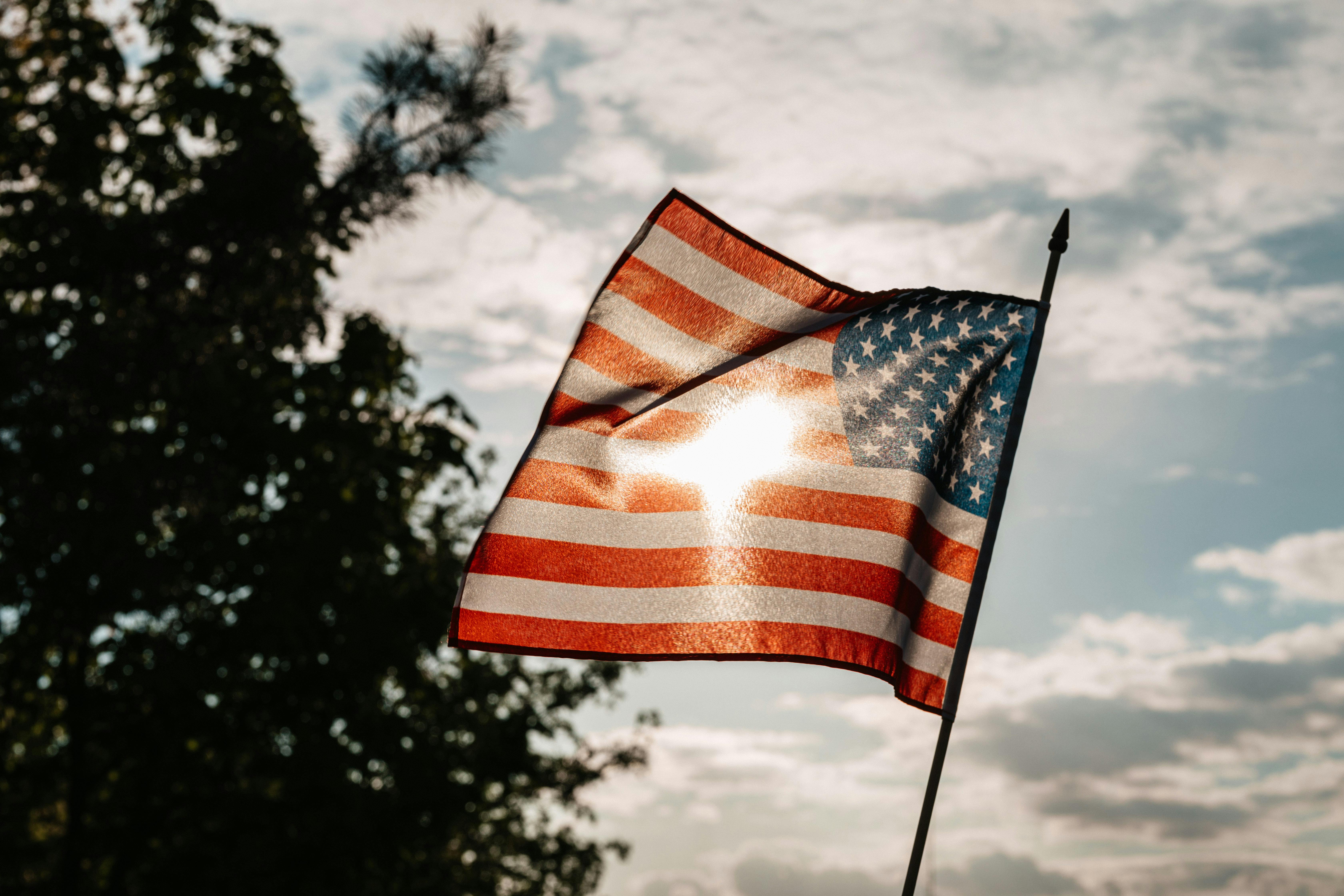 American flag with blue sky in the background 